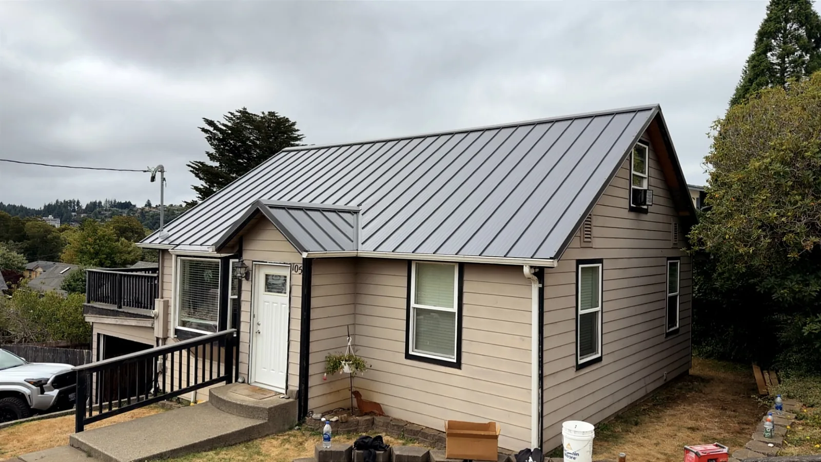 Small house with a new standing-seam metal roof